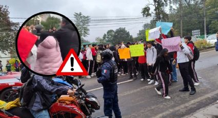 VIDEO: Bloqueo de estudiantes en carretera de Coatepec termina en golpes contra motociclista