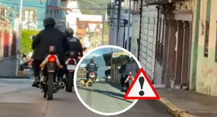 Graban a policía de Jalacingo en moto con perrito amarrado del cuello