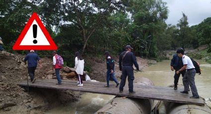 Vuelve a colapsar puente provisional en Misantla; pobladores cruzan arroyo sobre tubos