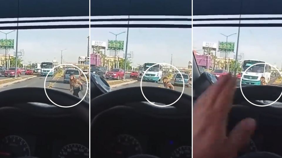 El conductor frente a la mujer toca el claxon para avisarle de la proximidad del camión.