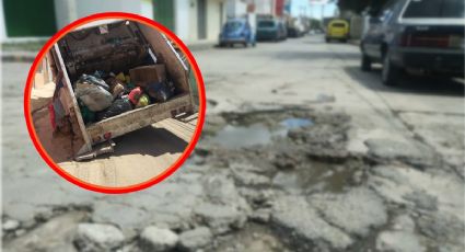 "Bachuca": camión recolector cae a enorme hoyo y queda atascado