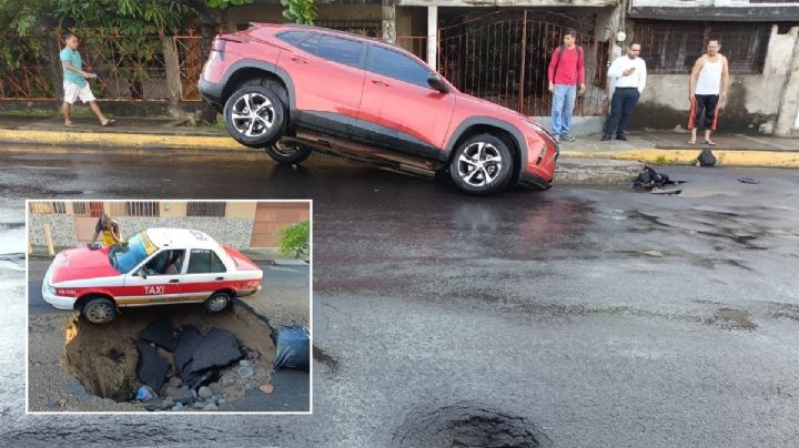 2 autos cayeron en socavones en la ciudad de Veracruz tras lluvias