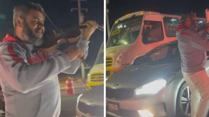 Alegra el paso vehicular con la música de su violín esperando unas monedas /VIDEO